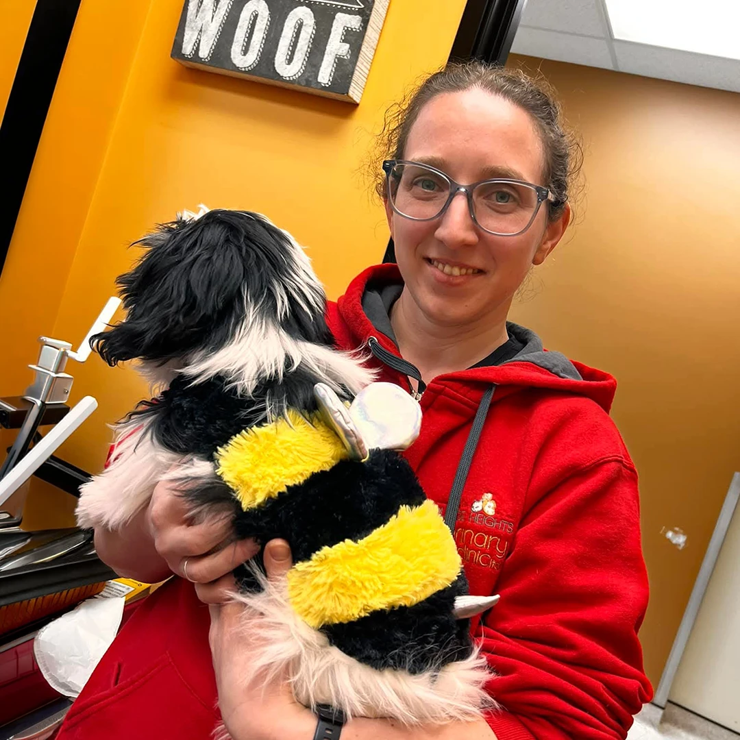 Carolina holding puppy in bee costume